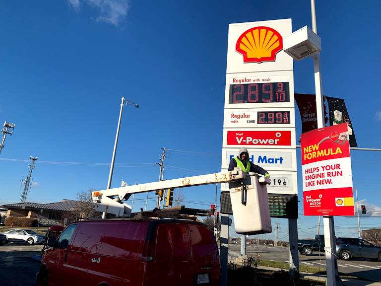 repairing-gas-station-price-sign